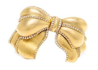 A Yellow Gold and Diamond Bow Brooch, 52.50 dwts.