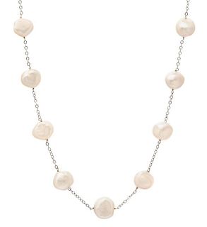 A 14 Karat White Gold and Cultured Pearl Station Necklace, 15.80 dwts.