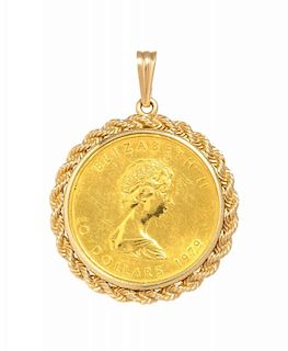 A 14 Karat Yellow Gold and Canada $50 1979 Maple Leaf Coin Pendant, 24.90 dwt.