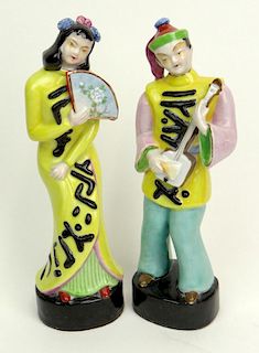 Pair of Retro Chinese Hollywood Regency Style Porcelain Figural Groups of Young Girl with Fan and Young Boy with Instrument.