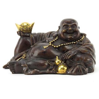 Chinese Bronze Reclining Buddha With Gilt Highlights.