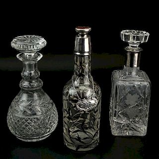 Grouping of Three (3) Decanters. Includes: two etched crystal and one overlay decanter.