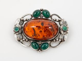 A Sterling Silver, Amber, and Dyed Green Chalcedony Brooch, Georg Jensen, 13.50 dwts.
