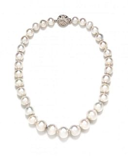 An 18 Karat White Gold, Diamond and Graduated South Sea Pearl Necklace, 71.00 dwts.