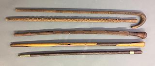 Three Chipped Carved Walking Sticks