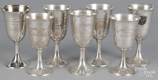 Seven sterling silver horse show goblets