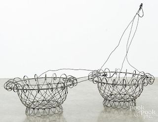 Pair of hanging wire baskets, 27'' h.