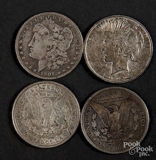 Three Morgan silver dollars, 1900, 1901, 1921