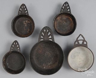 Five cast iron porringers, 19th c.