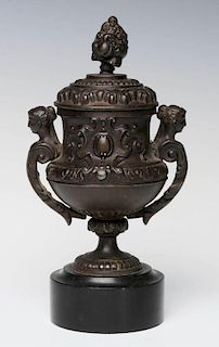 A SMALL 19TH CENTURY PATINATED SPELTER URN