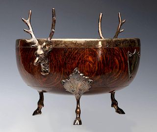 AN OAK CENTERPIECE WITH SILVER PLATED STAG MOUNTS