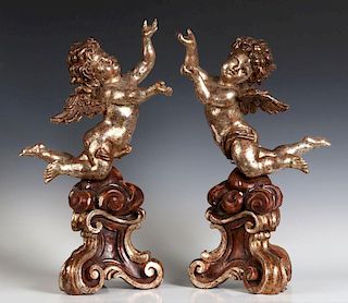 A PAIR 20TH C. ITALIAN CARVED ROCOCO-STYLE  PUTTI