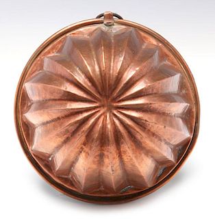 AN ANTIQUE COPPER FOOD MOLD