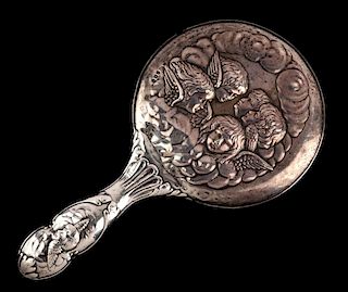A 1919 STERLING HAND MIRROR WITH REYNOLDS ANGELS