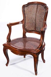 A LOUIS XV STYLE CANED FAUTEUIL ARMCHAIR