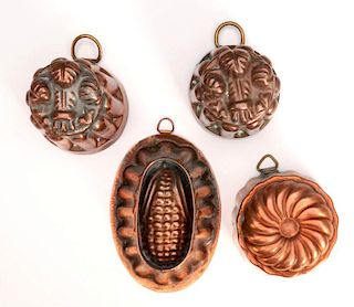 A COLLECTION OF SMALL COPPER FOOD MOLDS