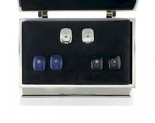 silver box with a pair of cufflinks