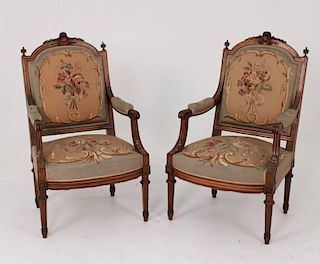 PAIR OF LOUIS XVI CARVED WALNUT FAUTEUILS