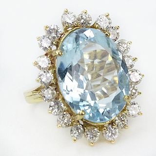 Vintage Approx. 13.70 Carat Oval Cut Aquamarine, 2.25 Carat Round Brilliant Cut Diamond and 14 Karat Yellow Gold Ring.