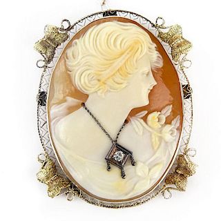 Antique 14 Karat Yellow Gold Filigree Mounted Carved Shell Cameo Pendant / Brooch with Diamond Accent.
