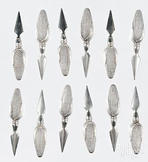 Twelve sterling silver handled corn spears.