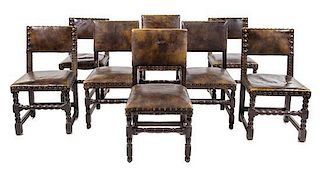 A Group of Eight French Renaissance Revival Oak Chairs Height 37 inches.