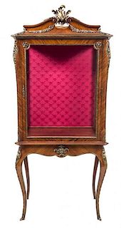 * A Louis XV Style Gilt Metal Mounted Rosewood Vitrine Height 78 3/4 x width 33 1/4 x depth 17 7/8 inches.