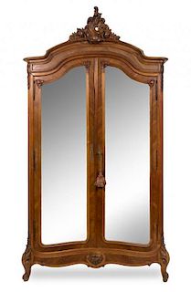 * A Louis XV Style Walnut Armoire Height 100 1/2 x width 51 x depth 19 inches.