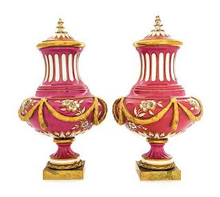 A Pair of Sevres Style Covered Porcelain Urns Height 17 inches.
