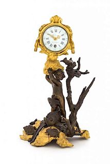 A French Gilt and Patinated Bronze Figural Clock Height 11 1/8 inches.