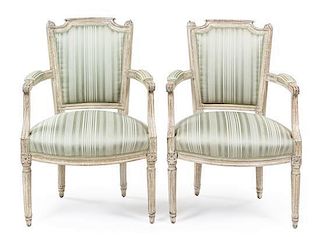 A Near Pair of Louis XVI Painted Fauteuils Height 34 inches.