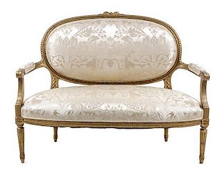 * A Louis XVI Style Giltwood Canape Height 40 1/4 x width 50 1/2 x depth 25 inches.