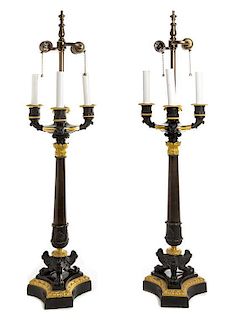 A Pair of Louis Philippe Style Patinated and Gilt Bronze Four-Light Candelabra Height overall 35 inches.