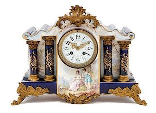 * A French Gilt Metal Mounted Porcelain Mantel Clock Width 15 1/2 inches.