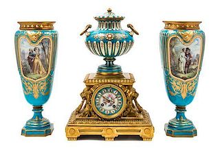 * An Assembled French Gilt Bronze Mounted Porcelain Clock Garniture Height of clock 16 1/2 inches, height of vases 14 3/4 inc