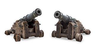 A Pair of French Ship's Cannons Height 20 1/2 x width 41 inches.