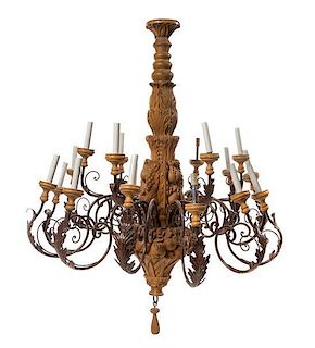 A Carved Wood Twenty-Seven Light Chandelier Height 47 5/8 x diameter 39 inches.