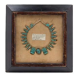 A Framed Egyptian Faience Bead Necklace Width overall 12 1/2 inches.