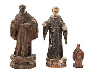 * Three Carved Wood Santos Figures