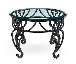 An Iron and Glass Center Table Height 23 3/4 inches.