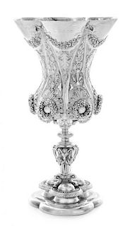 * A George IV Silver Chalice, Benjamin Smith II, London, 1828, the hexafoil rim with repousse floral and ribbon swags above t
