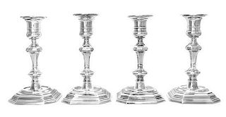 A Set of Four English Silver Candlesticks, Walter H. Wilson Ltd., London, 1955, each having a banded candle cup above the kno