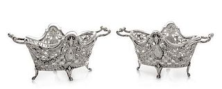 * A Pair of Continental Silver Bonbon Dishes, , each rim decorated with ram masks above an openwork body formed of floral and