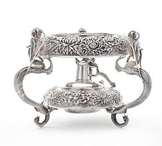 * A Japanese Silver Water Kettle Stand, Y. Konoike, Yokohama, Meiji Period, the kettle stand worked to show repousse chrysant