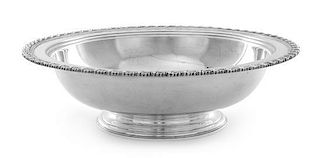 An American Silver Center Bowl, Tiffany & Co., New York, NY, the rim worked to show foliate banding, raised on a stepped circ