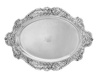 * An American Silver Serving Tray, Gorham Mfg. Co., Providence, RI, 1902, the oval platter with an undulating rim decorated w