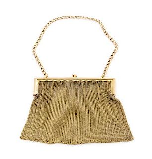 * A 15-Karat Gold Purse, , having a chain-mail bag with a chain-link handle.
