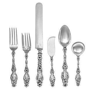 * An American Silver Flatware Service, Whiting Mfg. Co., New York, NY, Lily pattern, comprising: 12 dinner knives 12 dinner f