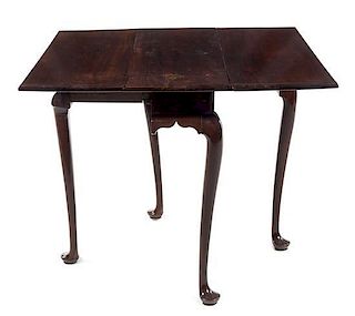 A Queen Anne Walnut Drop-Leaf Table Height 27 1/2 x width 12 (closed) x depth 31 1/4 inches.