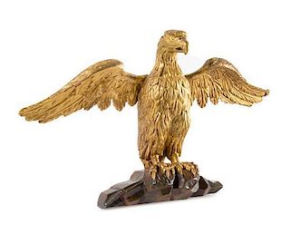 A Carved Giltwood Eagle Height 15 1/2 x width 26 inches.
